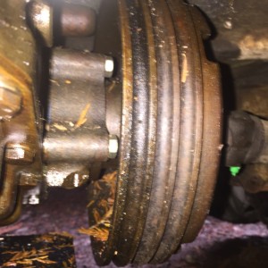 Transfer case output bearing cap and drum